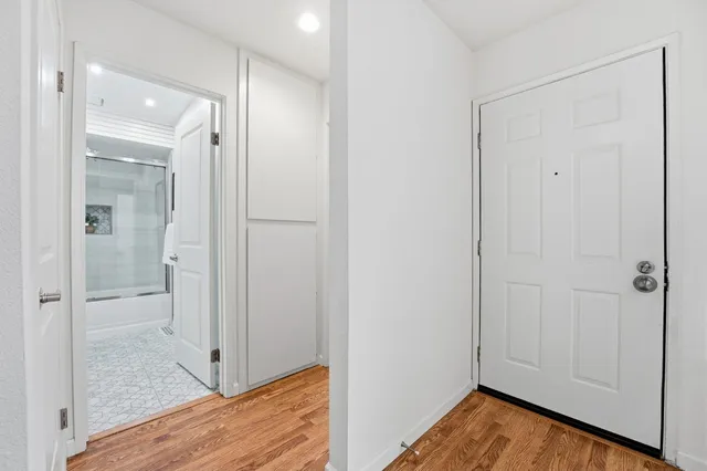a view of a workspace with furniture and a potted plant