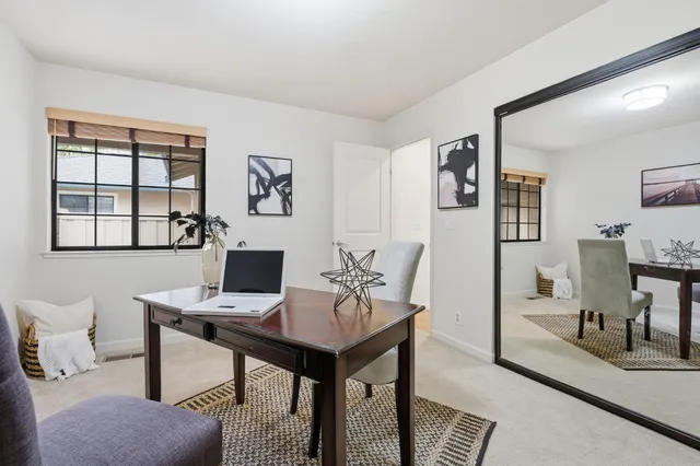 a view of a backyard with furniture and a garage