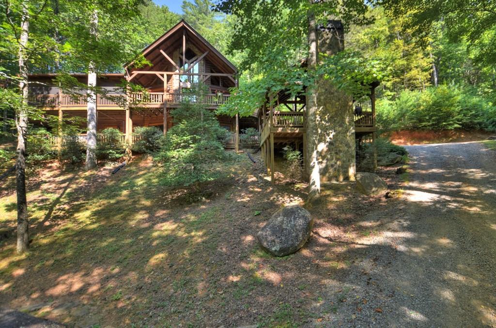 91 Dream Cove Road Cherry Log, GA 30522 - Photo 1 of 83 a view of a house with yard and sitting area