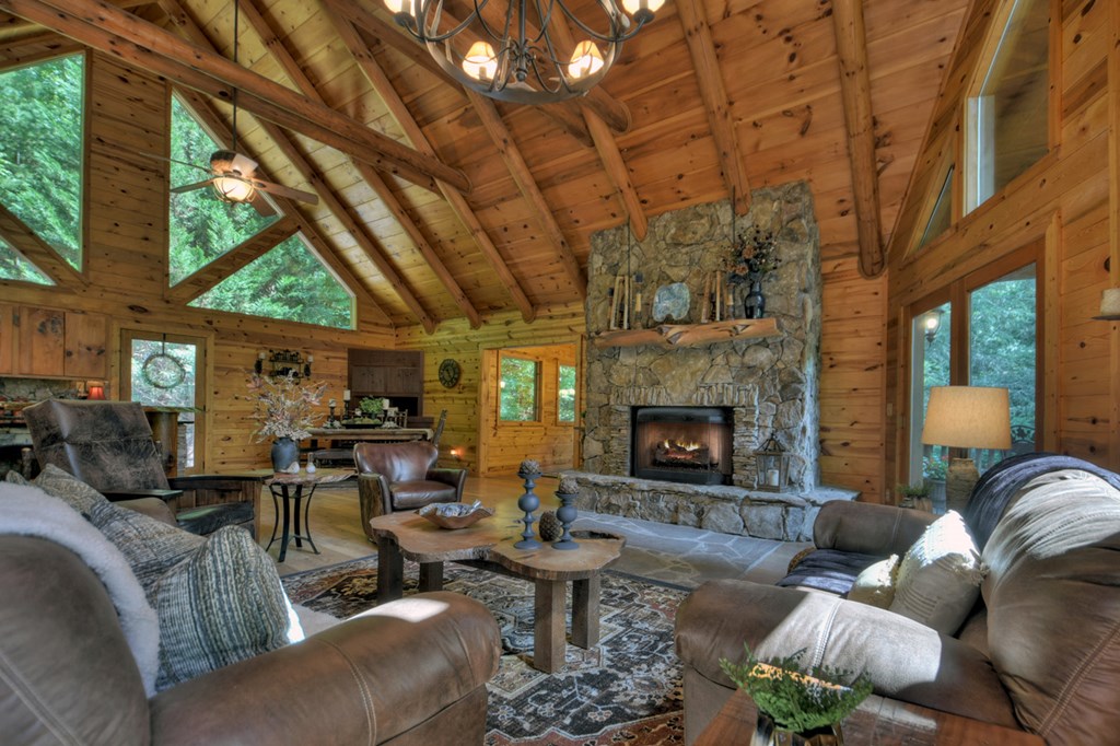 91 Dream Cove Road Cherry Log, GA 30522 - Photo 2 of 83 a living room with furniture large window and a fireplace
