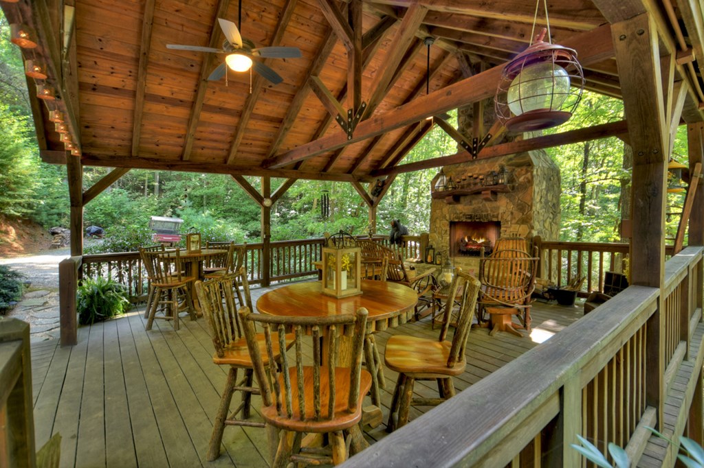 91 Dream Cove Road Cherry Log, GA 30522 - Photo 23 of 83 a view of a balcony with furniture and wooden floor