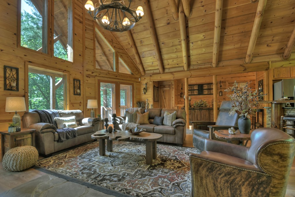 91 Dream Cove Road Cherry Log, GA 30522 - Photo 25 of 83 a living room with furniture and a large window