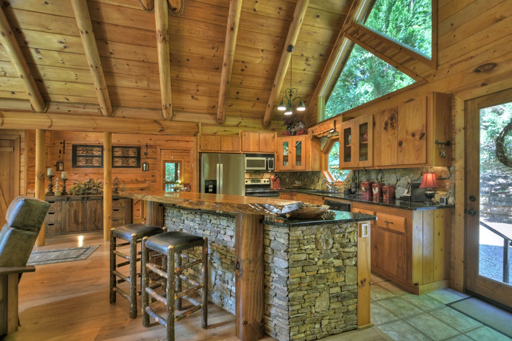 91 Dream Cove Road Cherry Log, GA 30522 - Photo 40 of 83 a kitchen with stainless steel appliances granite countertop a stove and a refrigerator