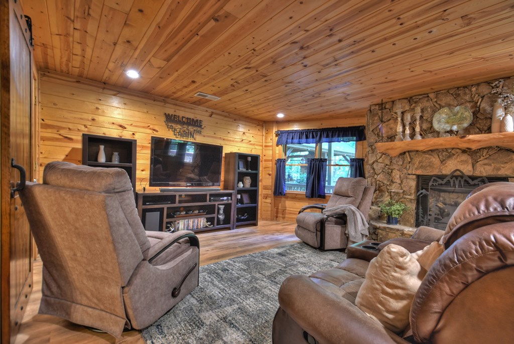 91 Dream Cove Road Cherry Log, GA 30522 - Photo 50 of 83 a living room with furniture and a flat screen tv