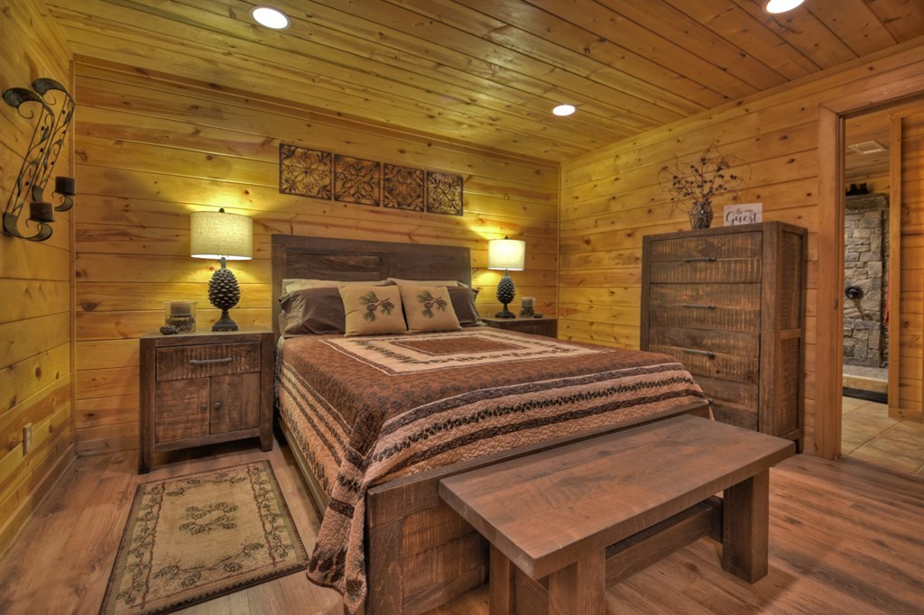 91 Dream Cove Road Cherry Log, GA 30522 - Photo 52 of 83 a bedroom with a bed and wooden floor