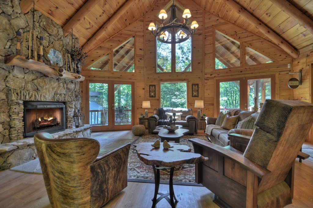 91 Dream Cove Road Cherry Log, GA 30522 - Photo 6 of 83 a living room with furniture a fireplace and a dining table