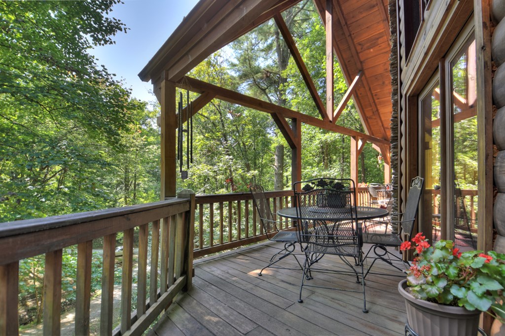 91 Dream Cove Road Cherry Log, GA 30522 - Photo 61 of 83 a view of a two chairs and table in the balcony