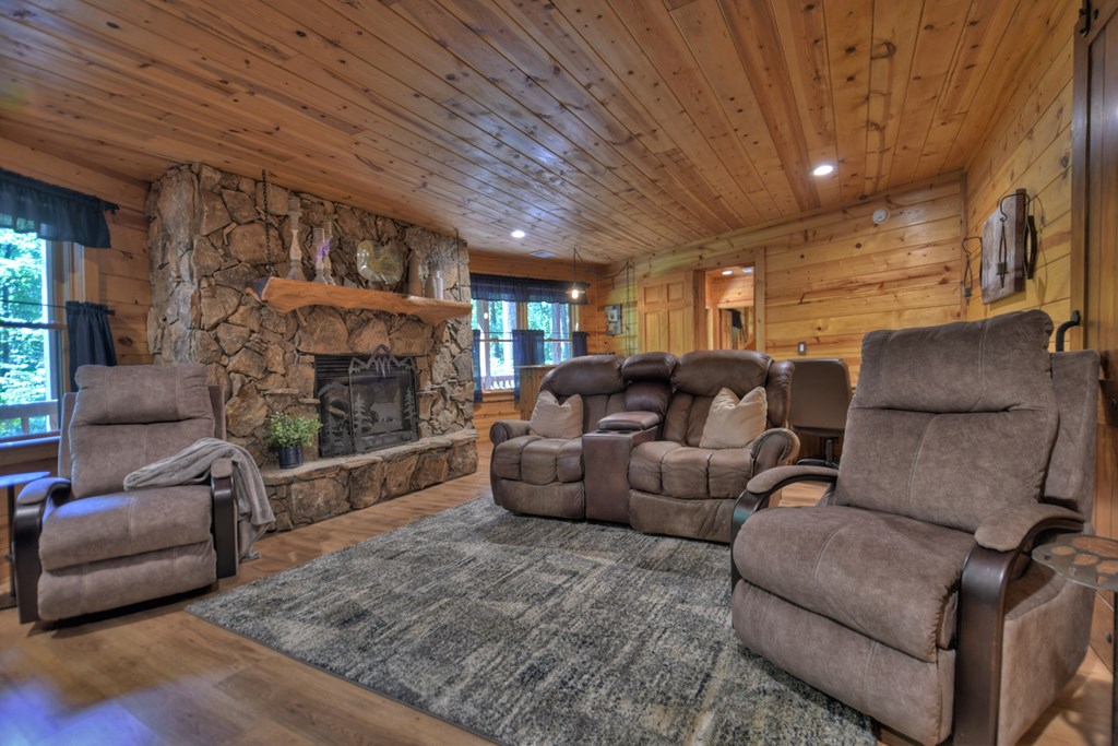 91 Dream Cove Road Cherry Log, GA 30522 - Photo 8 of 83 a living room with furniture and a fireplace