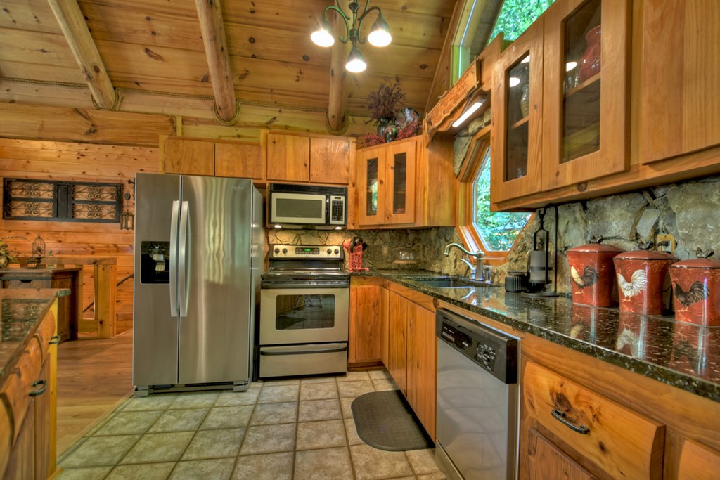 91 Dream Cove Road Cherry Log, GA 30522 - Photo 82 of 83 a kitchen with stainless steel appliances granite countertop a refrigerator a stove and a sink