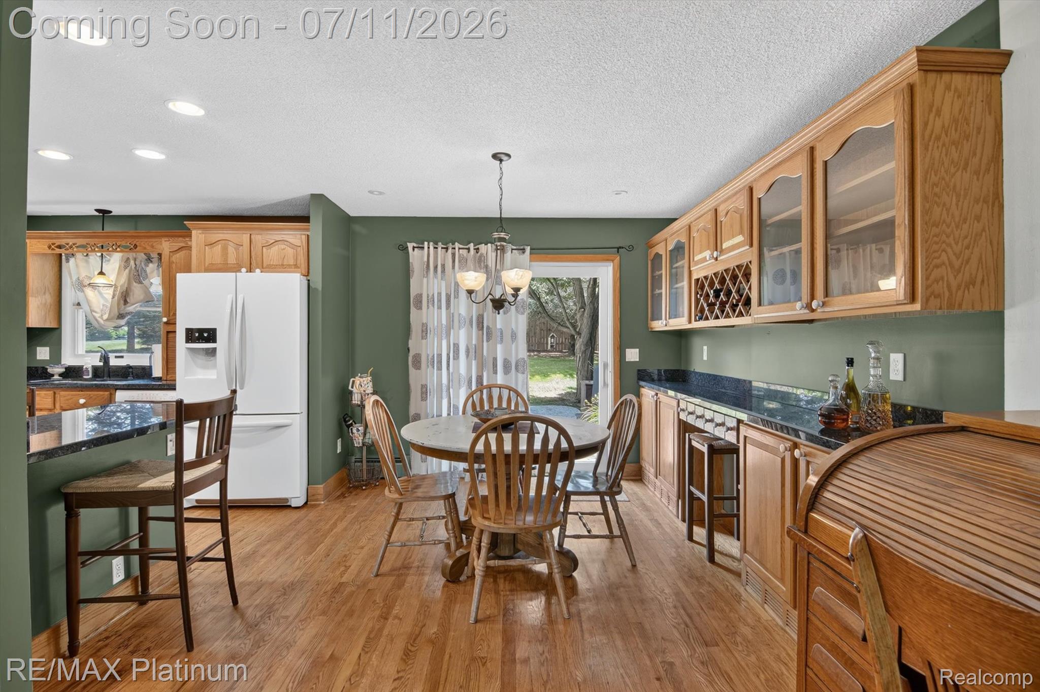 13365 North Territorial Road Gregory, MI 48137 - Photo 15 of 52 Open concept kitchen and dining area featuring wood-finish flooring, recessed lighting, and a sliding glass door