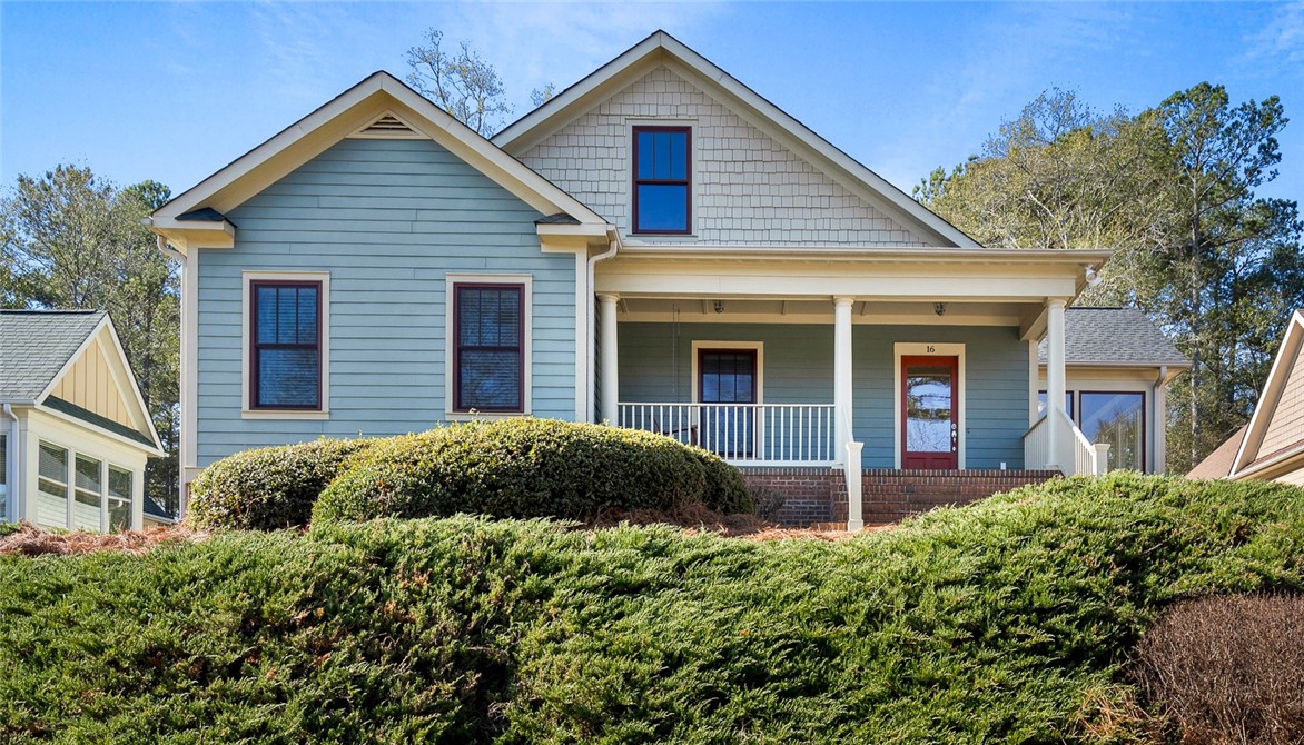 16 Oleander Drive Anderson, SC 29621 - Photo 1 of 37 A charming home boasts an inviting front porch and a neatly landscaped hillside.