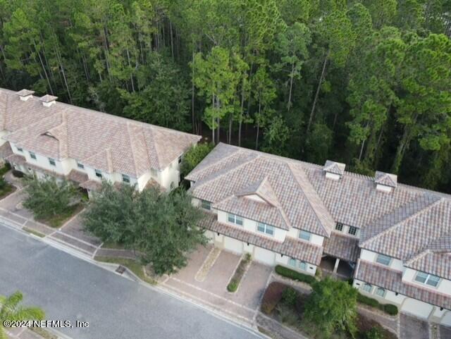 28 Grand Ravine Drive St. Augustine, FL 32086 - Photo 2 of 55 an aerial view of a house with green space and street view