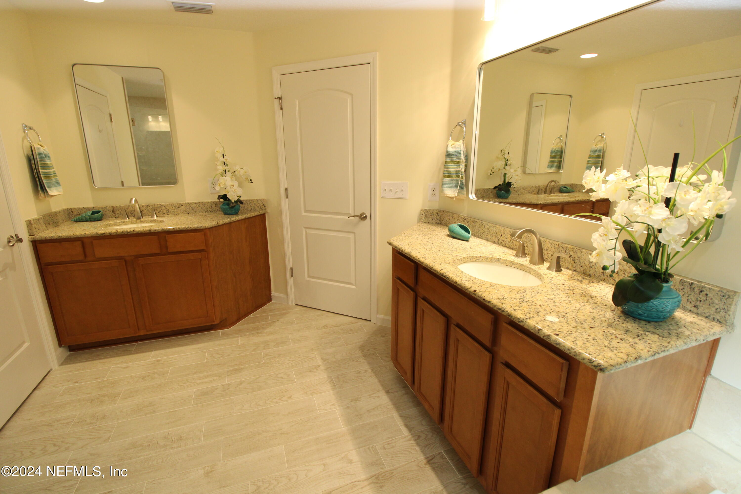 28 Grand Ravine Drive St. Augustine, FL 32086 - Photo 27 of 55 a bathroom with a granite countertop sink and a mirror