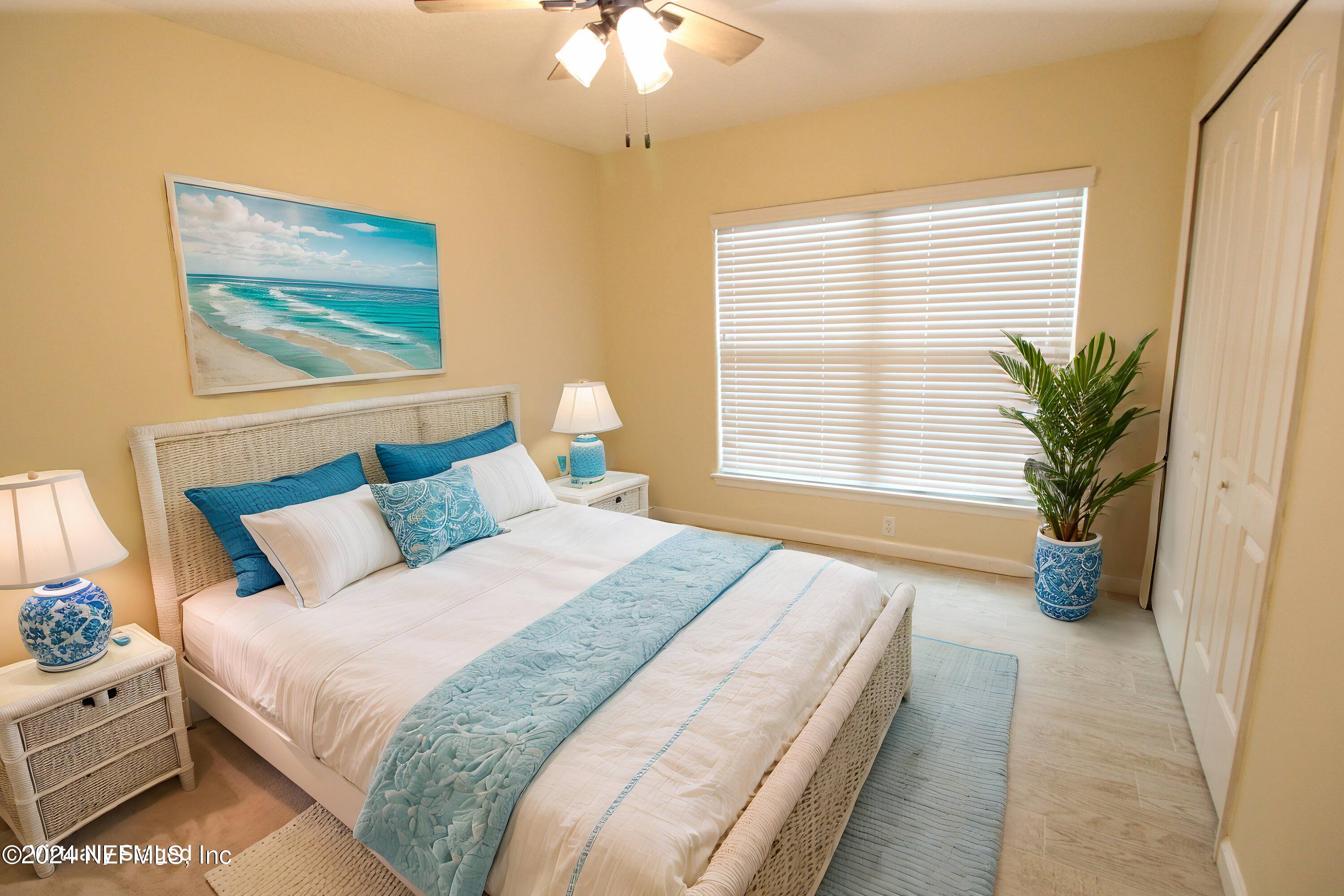 28 Grand Ravine Drive St. Augustine, FL 32086 - Photo 30 of 55 a bedroom with bed and a potted plant