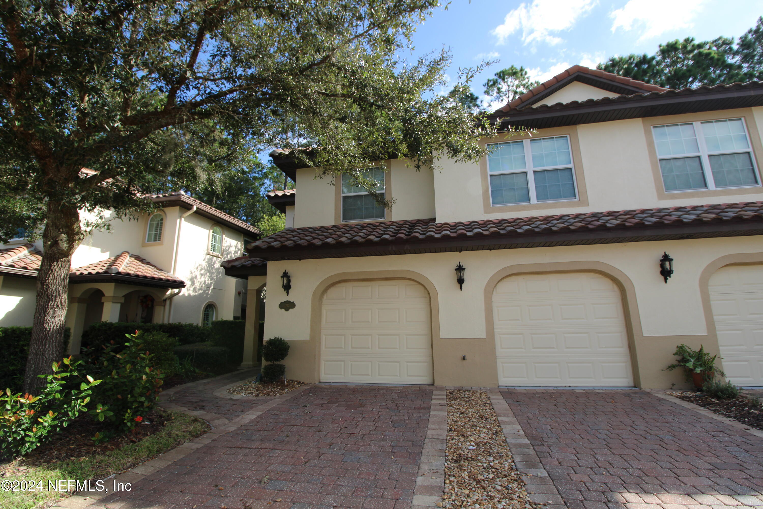 28 Grand Ravine Drive St. Augustine, FL 32086 - Photo 3 of 55 a front view of a house with garden