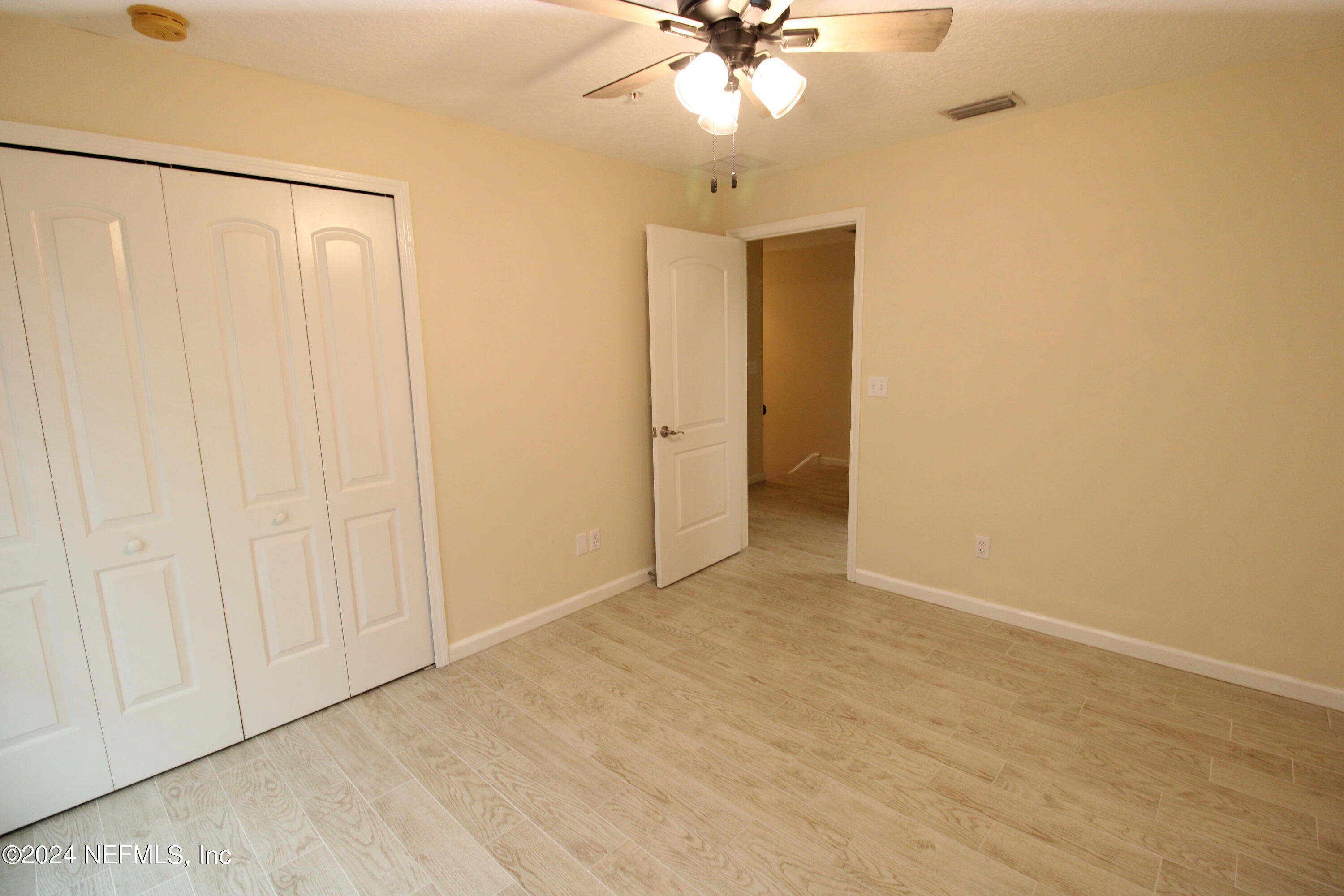 28 Grand Ravine Drive St. Augustine, FL 32086 - Photo 32 of 55 a view of an empty room with a fan