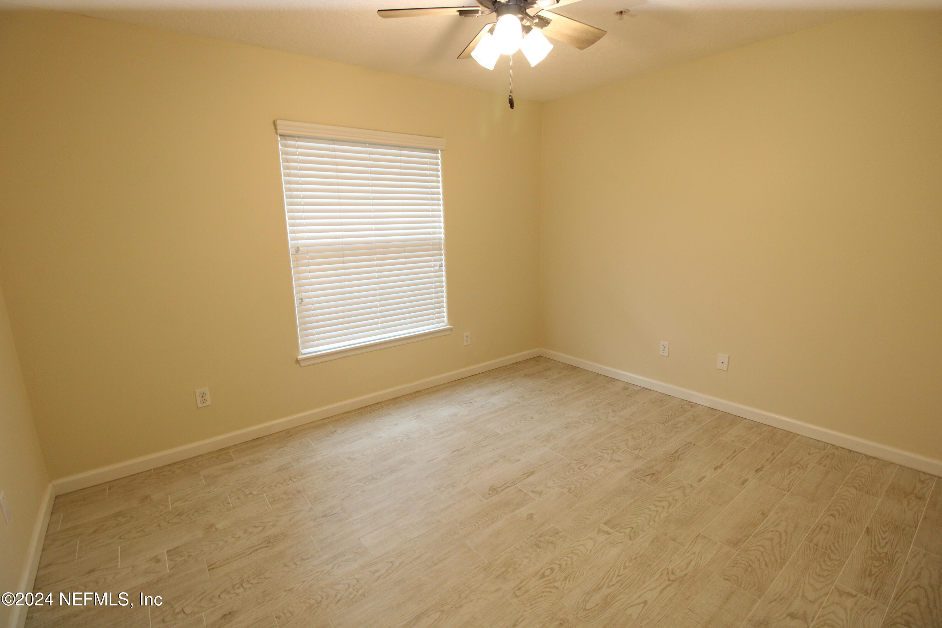 28 Grand Ravine Drive St. Augustine, FL 32086 - Photo 34 of 55 an empty room with a chandelier fan