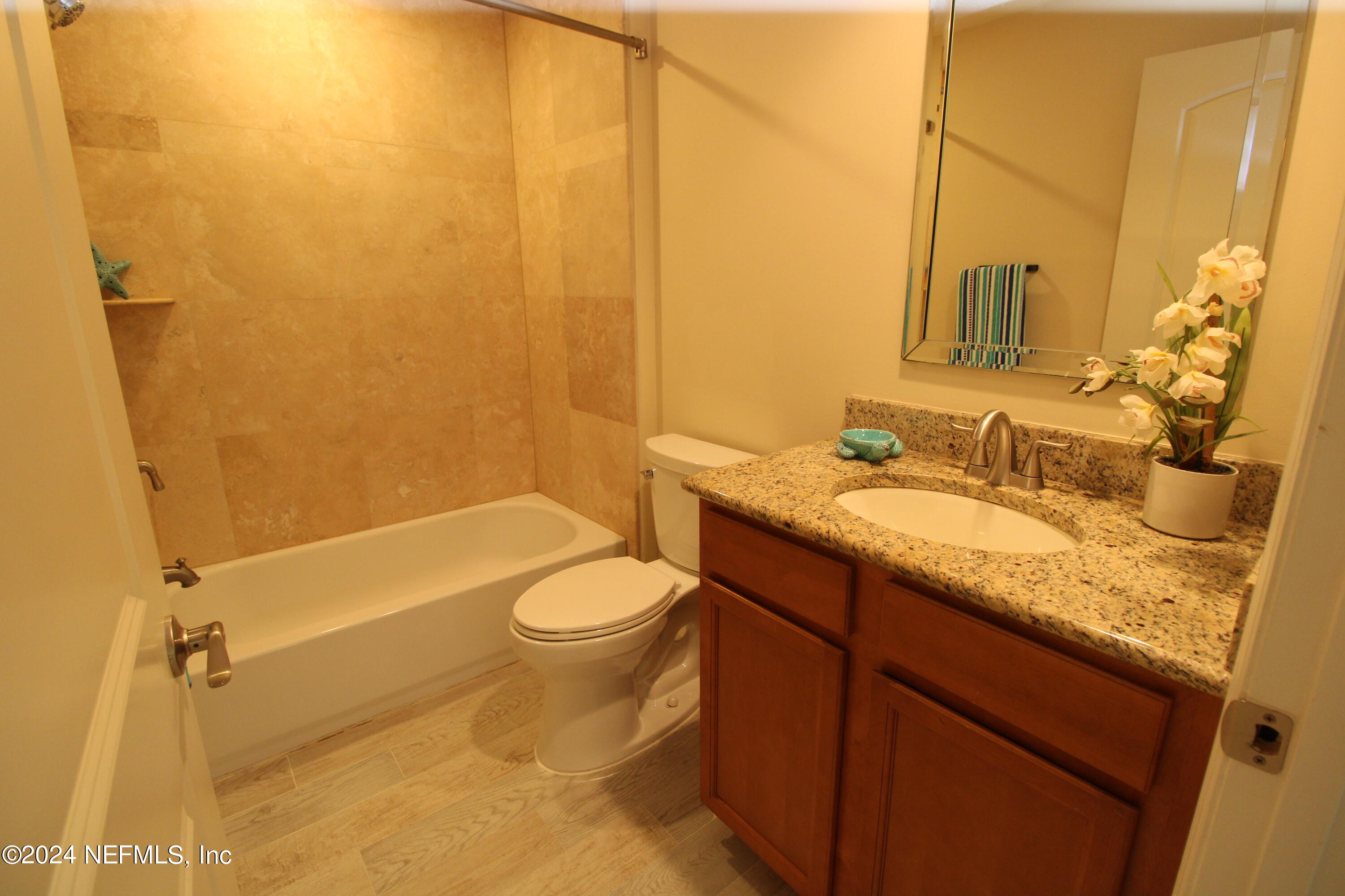 28 Grand Ravine Drive St. Augustine, FL 32086 - Photo 37 of 55 a bathroom with a granite countertop sink toilet and shower