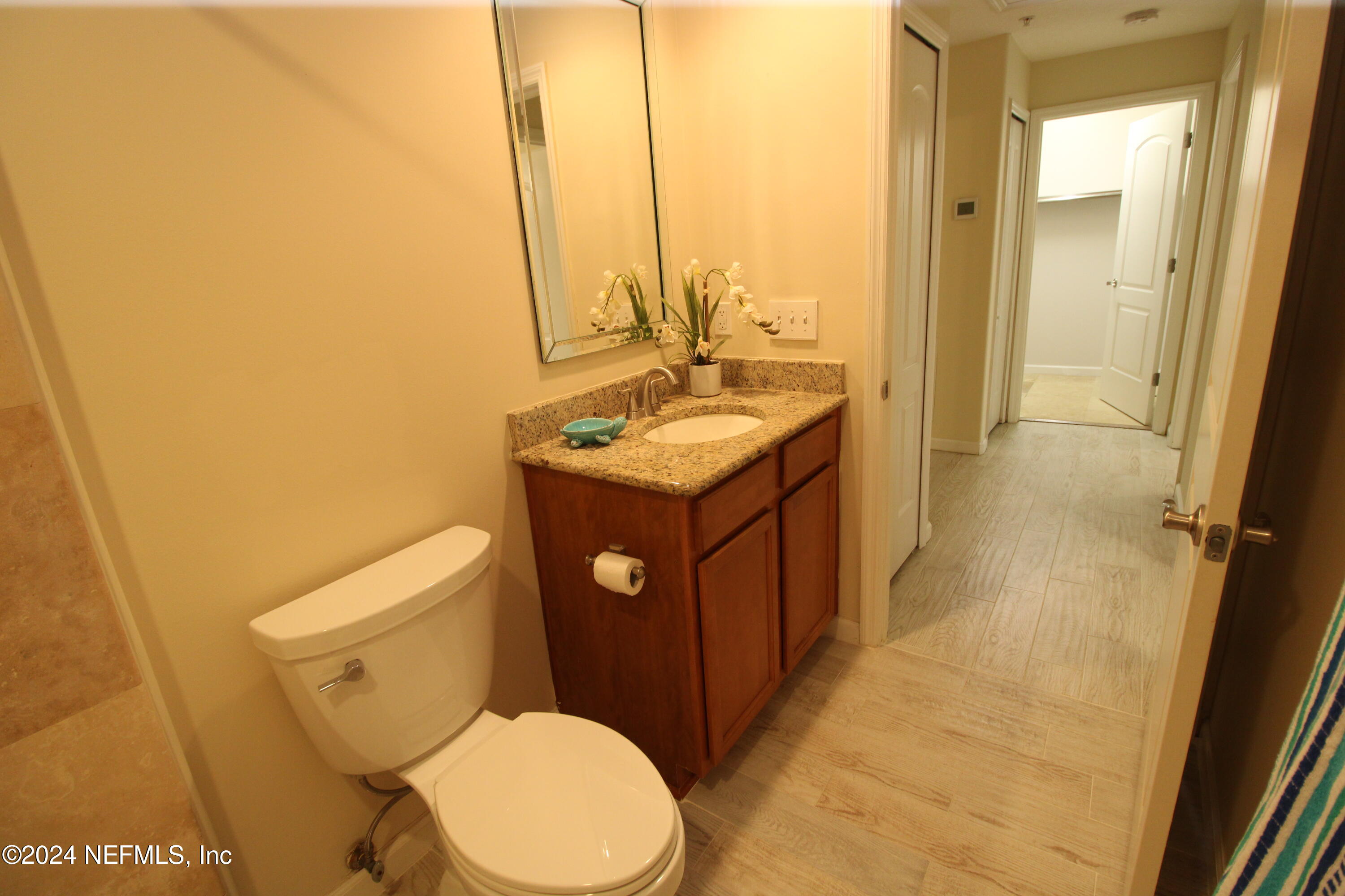 28 Grand Ravine Drive St. Augustine, FL 32086 - Photo 39 of 55 a bathroom with a toilet sink and mirror