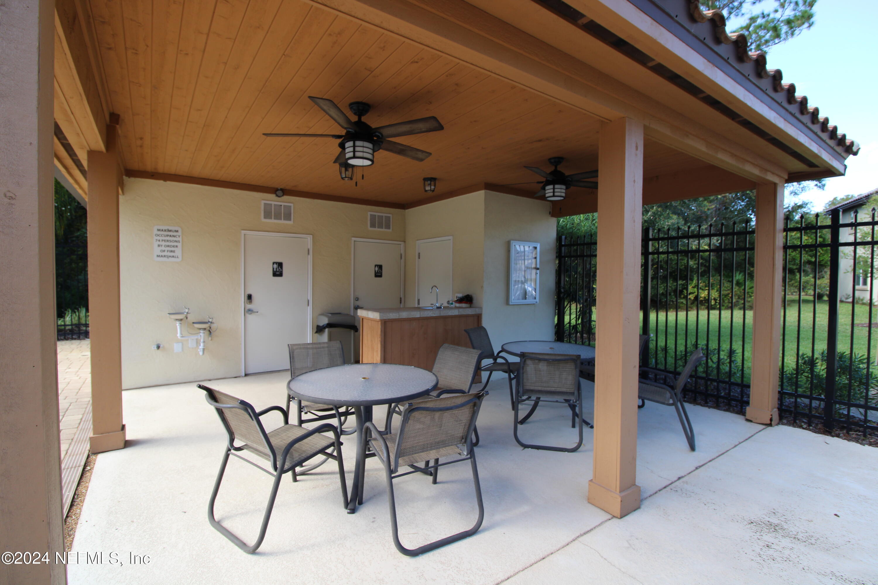28 Grand Ravine Drive St. Augustine, FL 32086 - Photo 51 of 55 a dining room with furniture and a garden