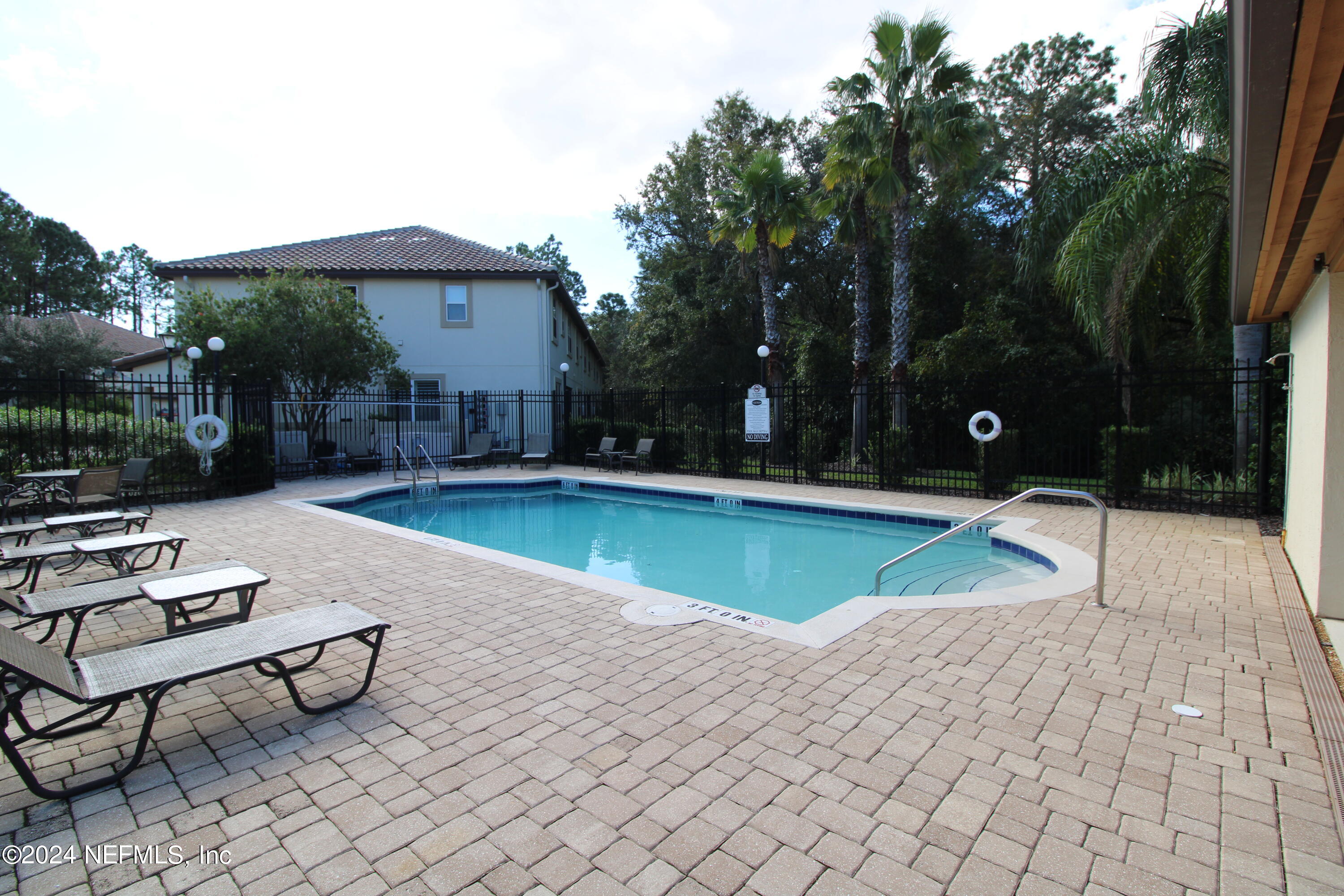 28 Grand Ravine Drive St. Augustine, FL 32086 - Photo 52 of 55 a view of a house with swimming pool and sitting area
