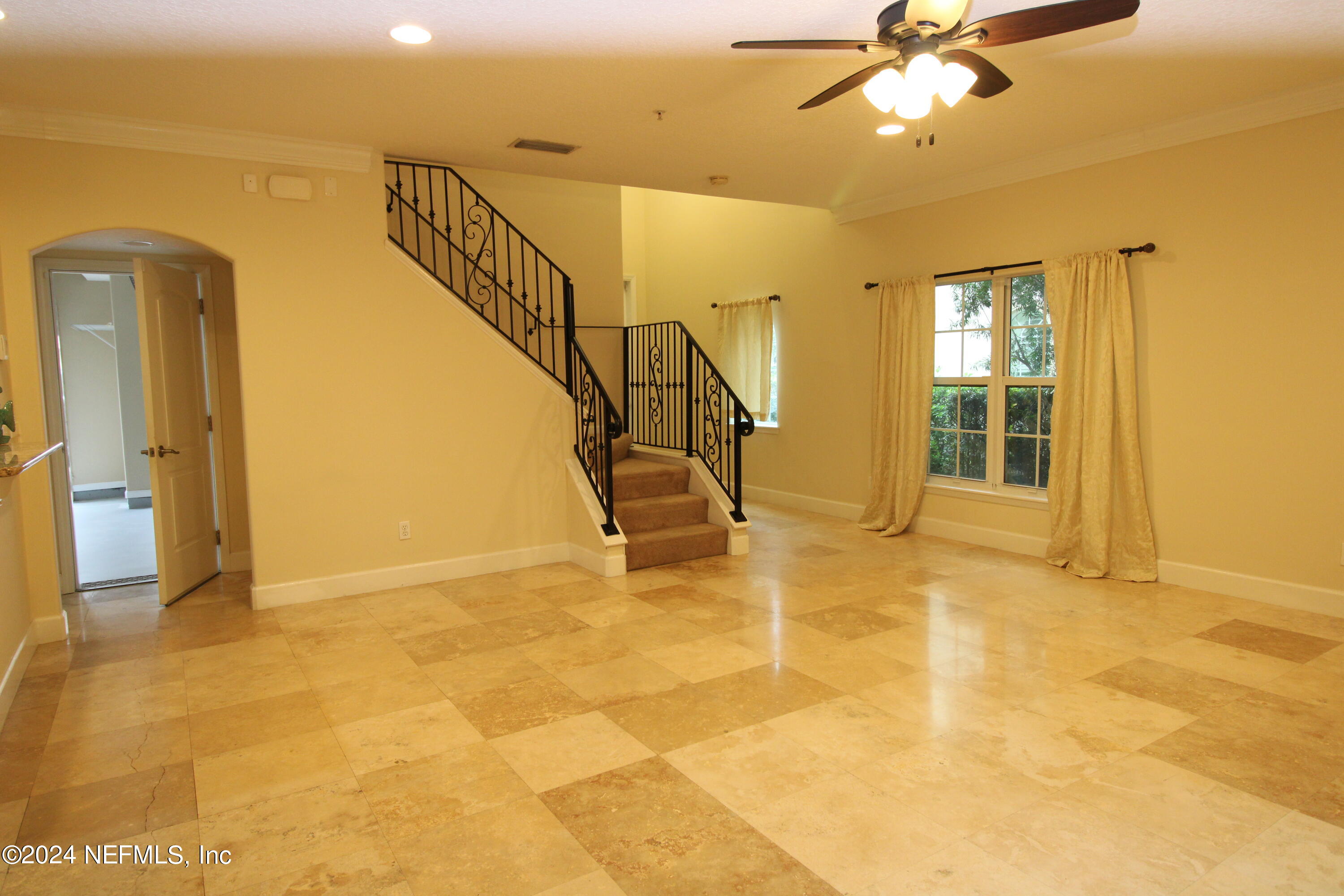 28 Grand Ravine Drive St. Augustine, FL 32086 - Photo 7 of 55 a view of an entryway with a floor to ceiling window and a ceiling fan