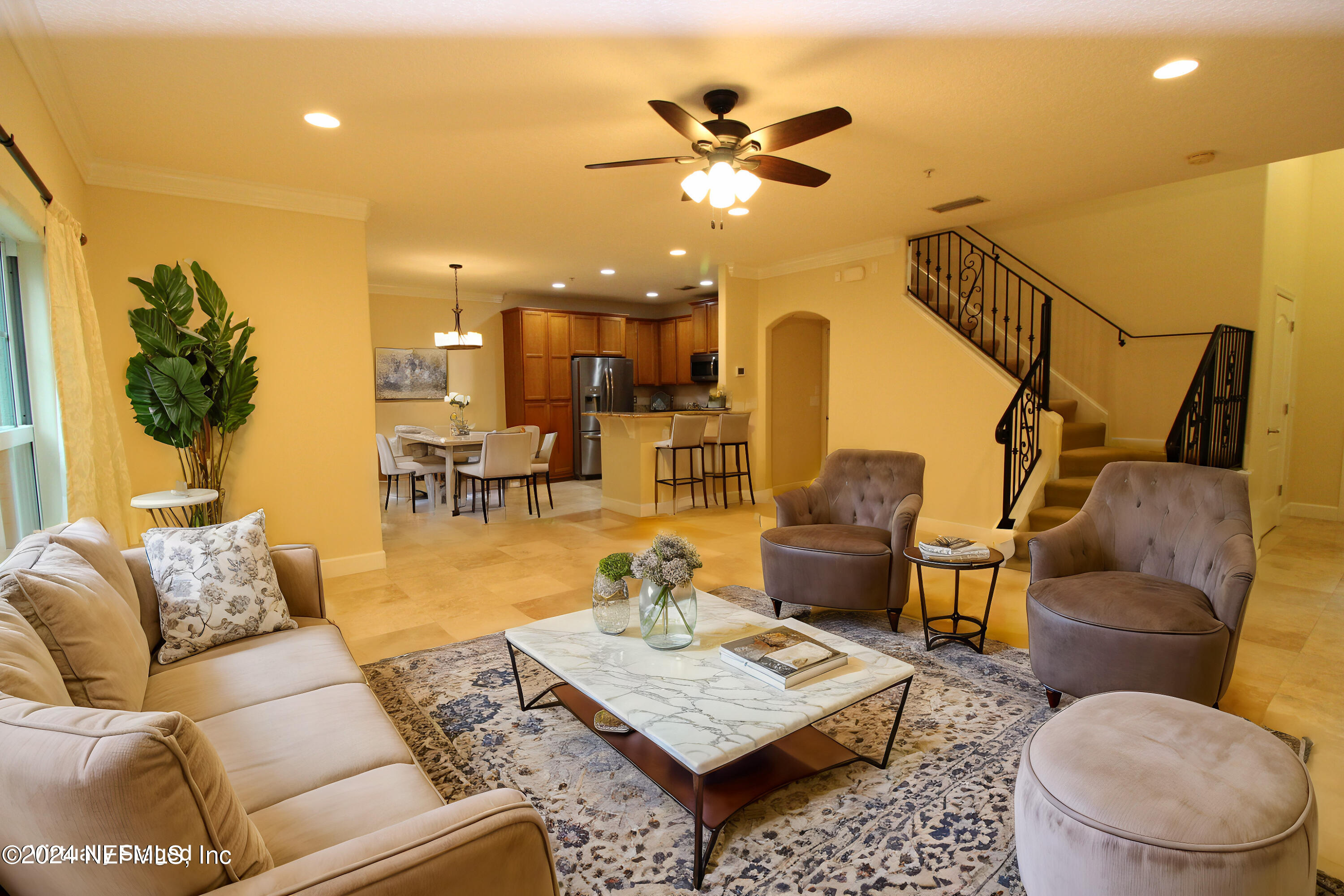 28 Grand Ravine Drive St. Augustine, FL 32086 - Photo 9 of 55 a living room with furniture and a chandelier