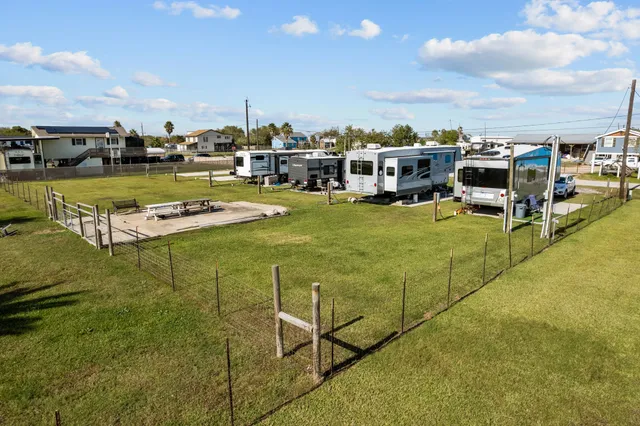 a swimming pool with outdoor seating and yard