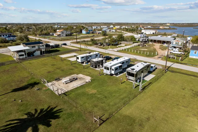 an aerial view of residential houses with outdoor space