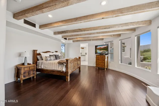 a spacious bathroom with a tub sink and mirror