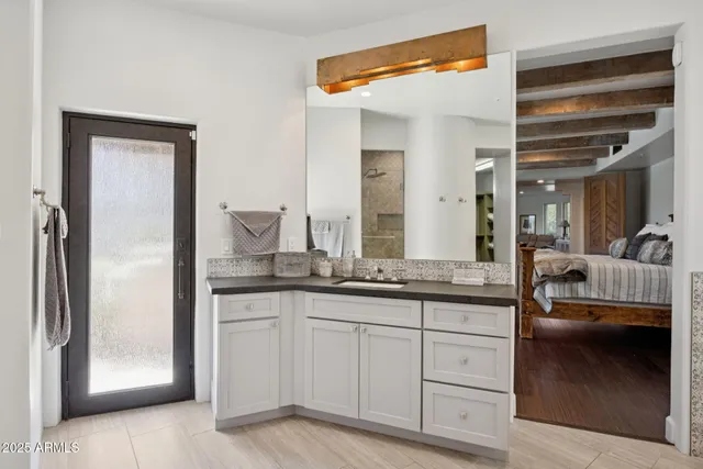 a bedroom with a bed and a bookshelf