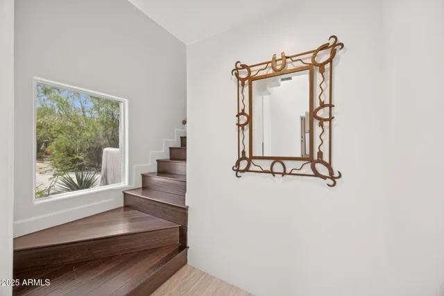 a living room with furniture a rug and a flat screen tv