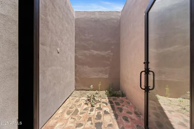 a view of a floor to ceiling window and a bath tub