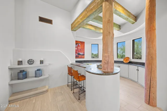 a kitchen with white cabinets and a sink