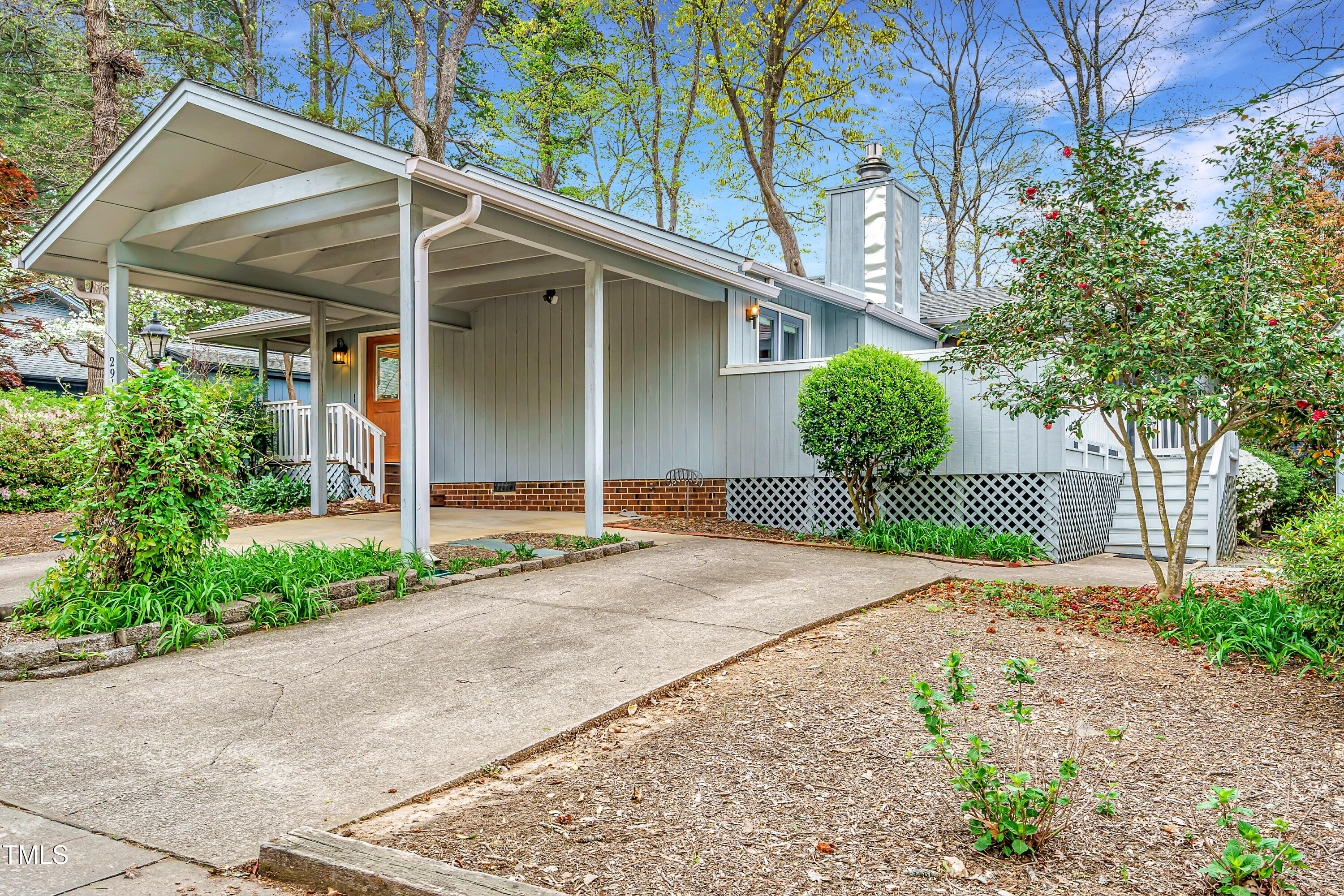 2916 Rue Sans Famille Raleigh, NC 27607 - Photo 1 of 32 a front view of a house with a yard and garage