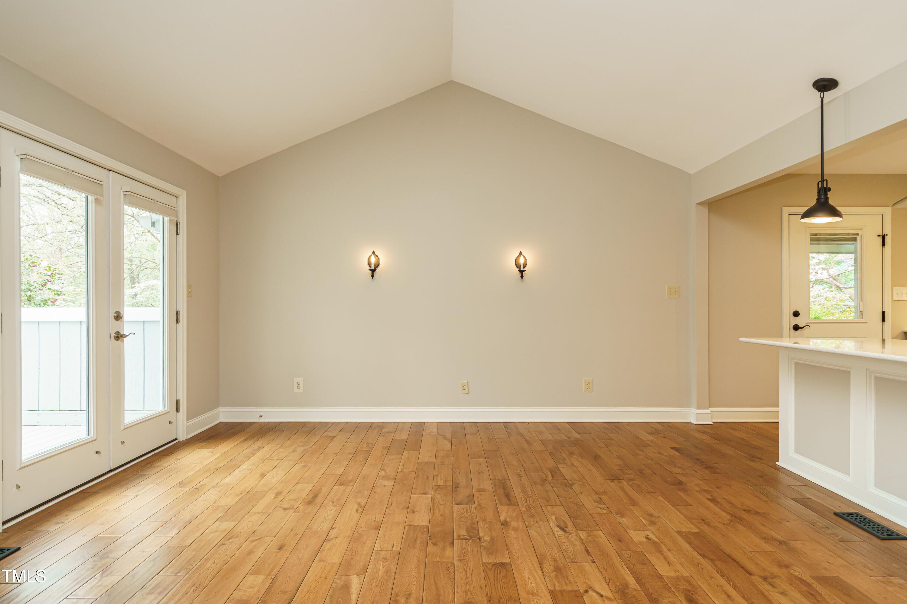 2916 Rue Sans Famille Raleigh, NC 27607 - Photo 17 of 32 a view of empty room with wooden floor and fan
