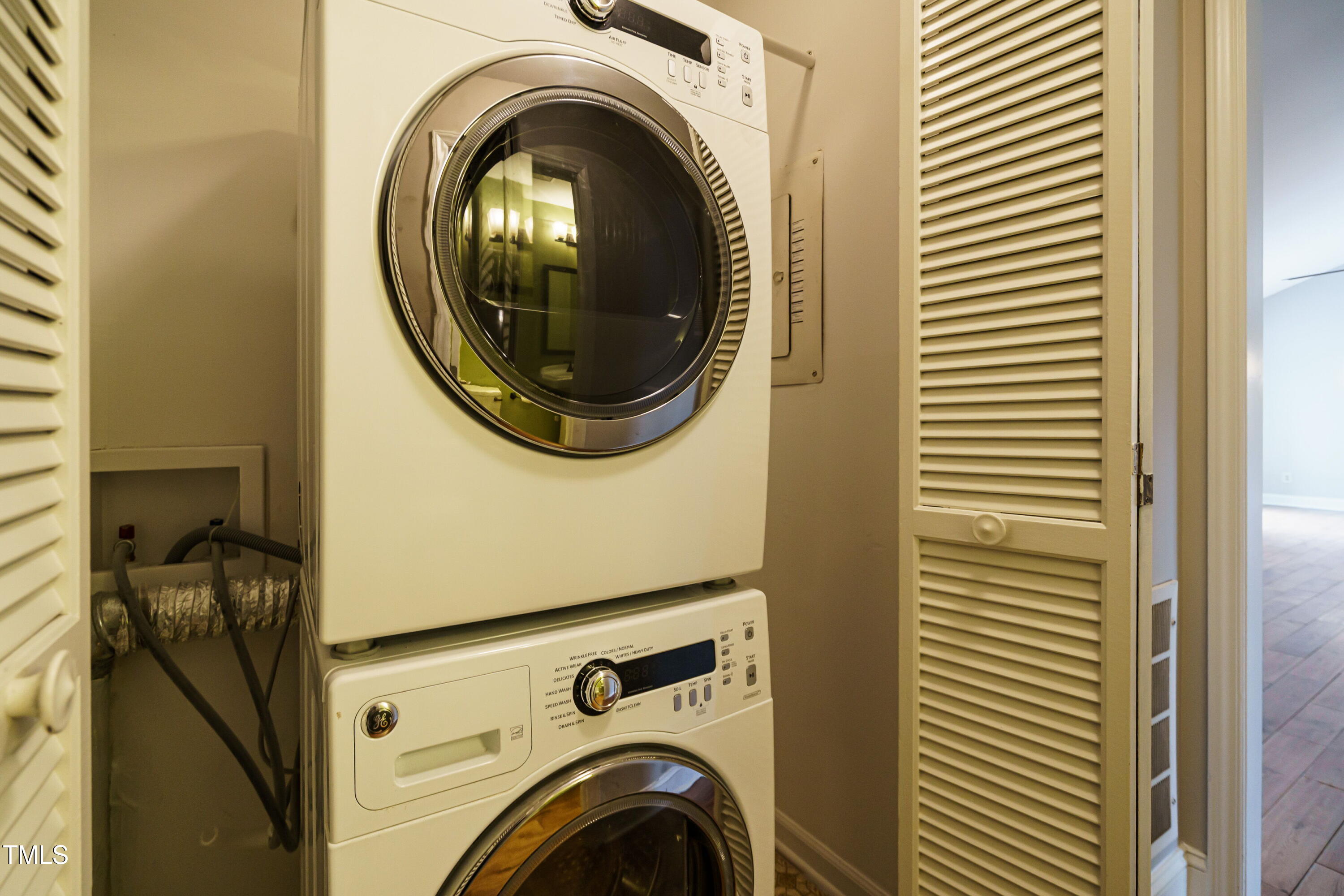2916 Rue Sans Famille Raleigh, NC 27607 - Photo 26 of 32 a utility room with dryer and washer