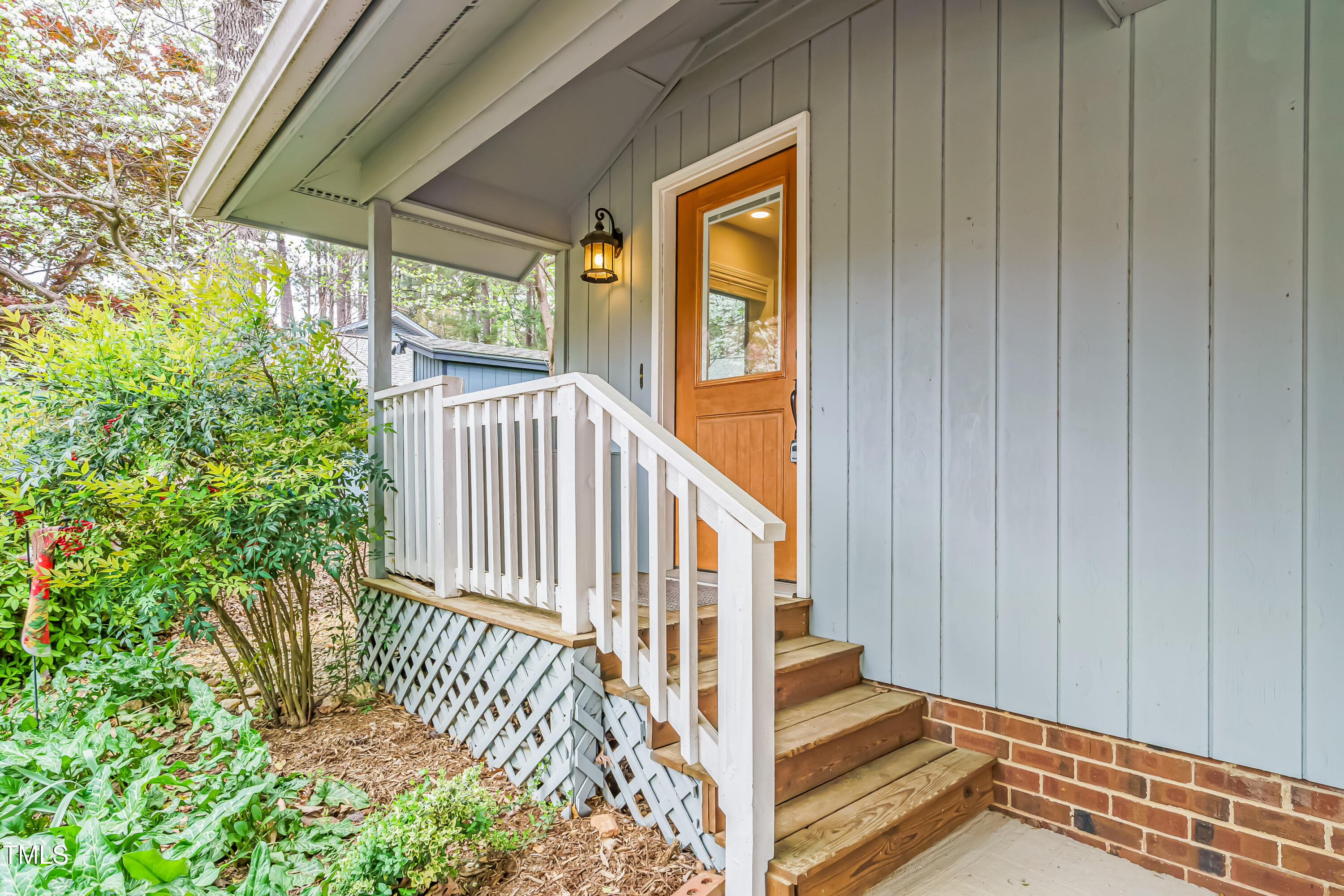 2916 Rue Sans Famille Raleigh, NC 27607 - Photo 2 of 32 a view of staircase with wooden floor and a potted plant