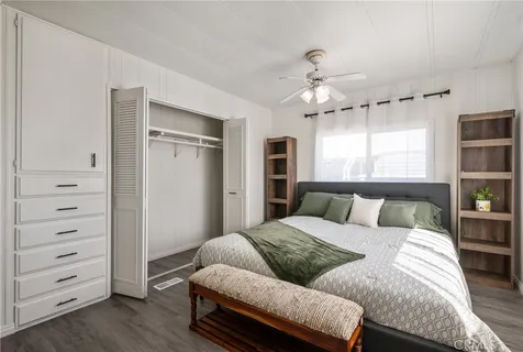 a bed room with a bed and a window