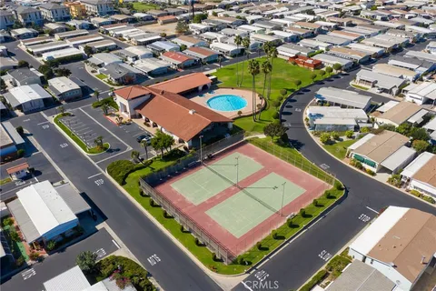 an aerial view of residential houses with parking