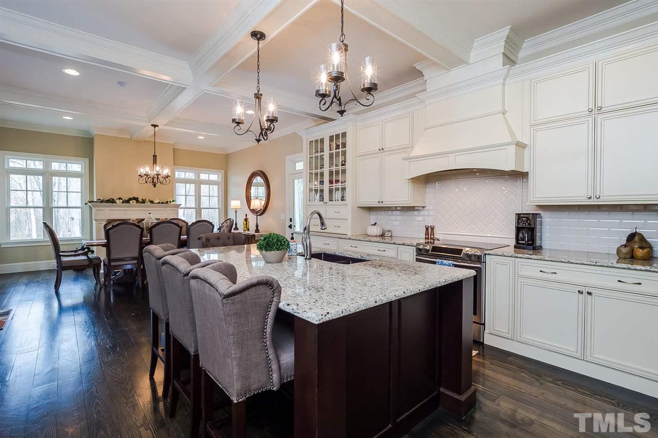 5006 Redwood Road Durham, NC 27704 - Photo 14 of 25 a large kitchen with a table and chairs
