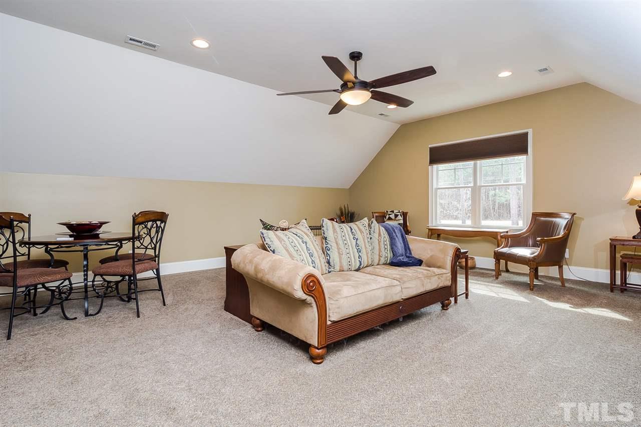 5006 Redwood Road Durham, NC 27704 - Photo 22 of 25 a living room with furniture and a window