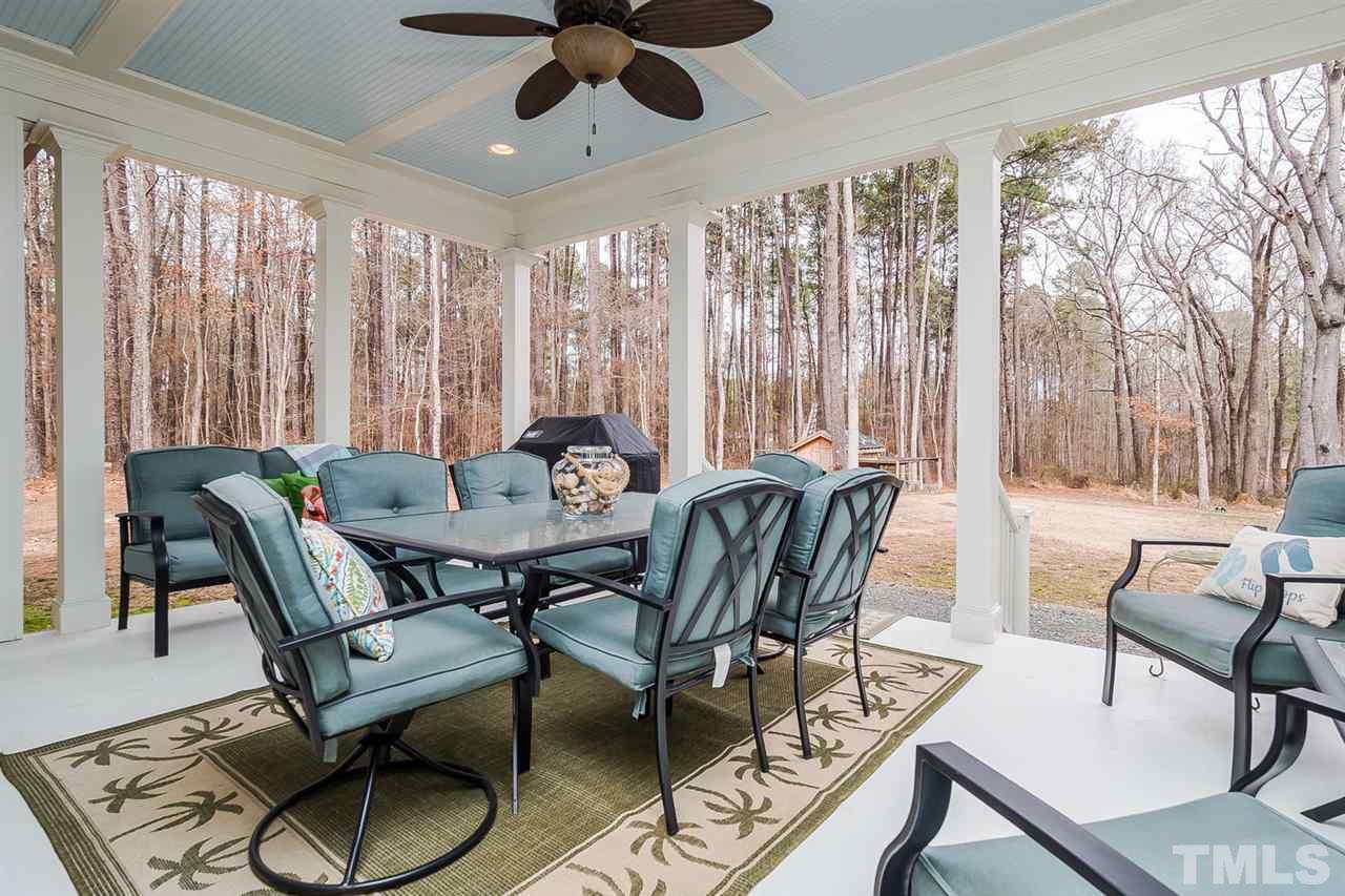 5006 Redwood Road Durham, NC 27704 - Photo 23 of 25 a view of a dining room with furniture window and outside view