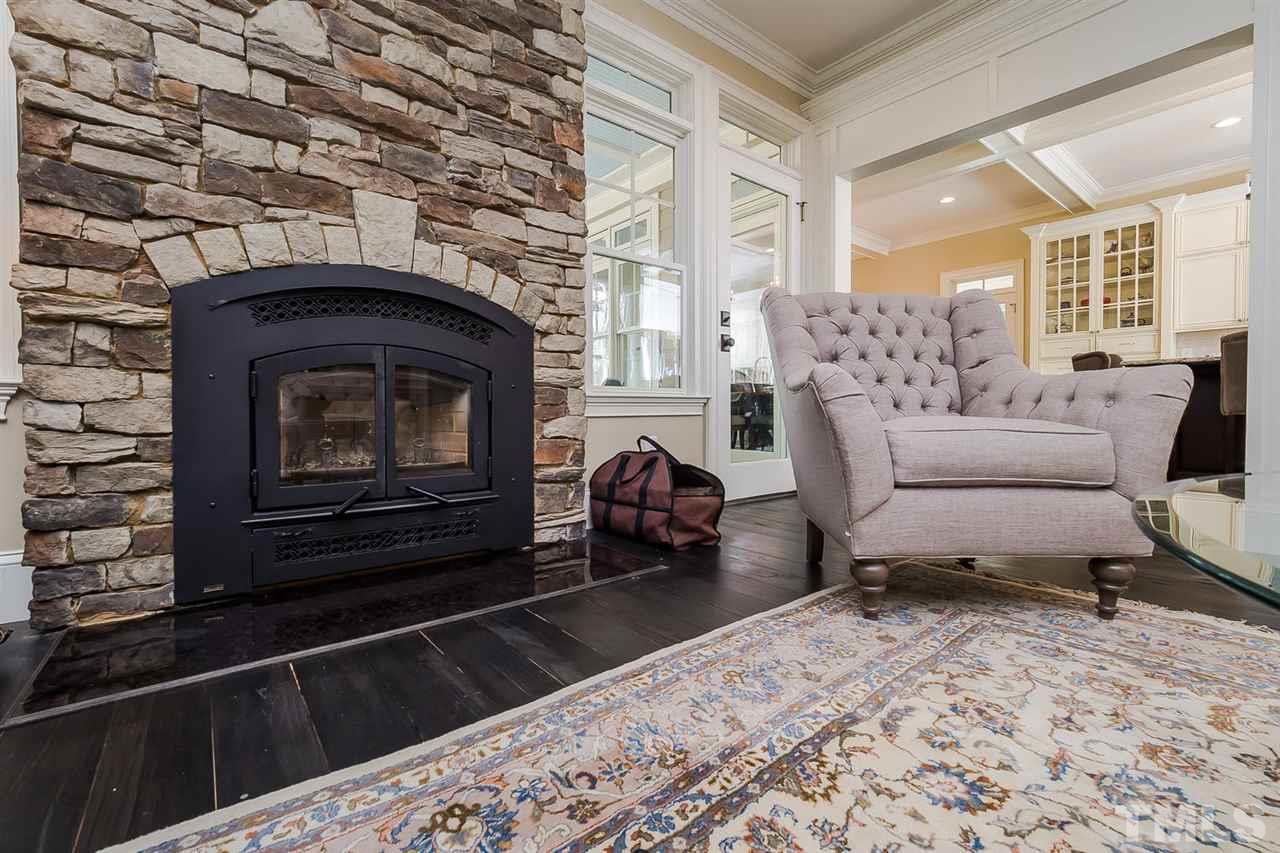 5006 Redwood Road Durham, NC 27704 - Photo 5 of 25 a living room with furniture and a fireplace