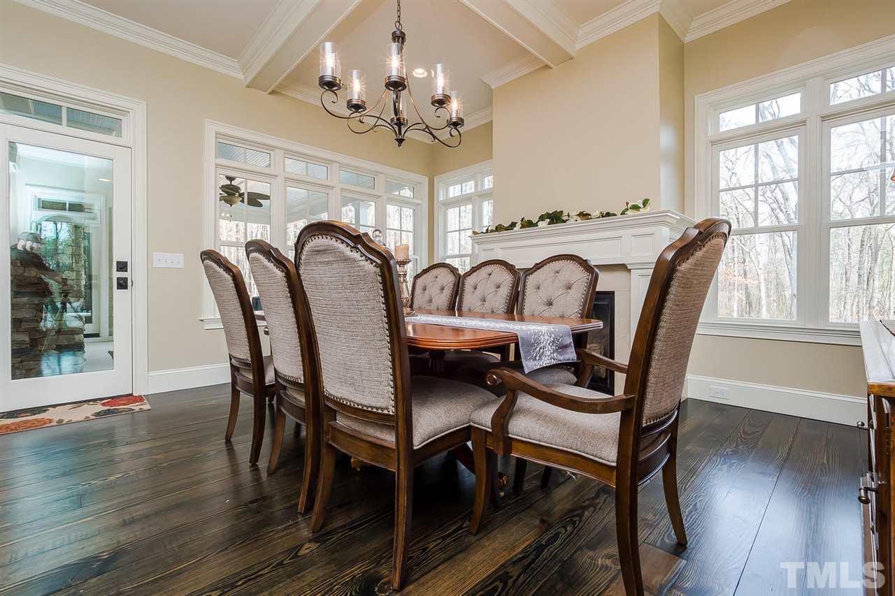5006 Redwood Road Durham, NC 27704 - Photo 7 of 25 a view of a dining room with furniture window and wooden floor
