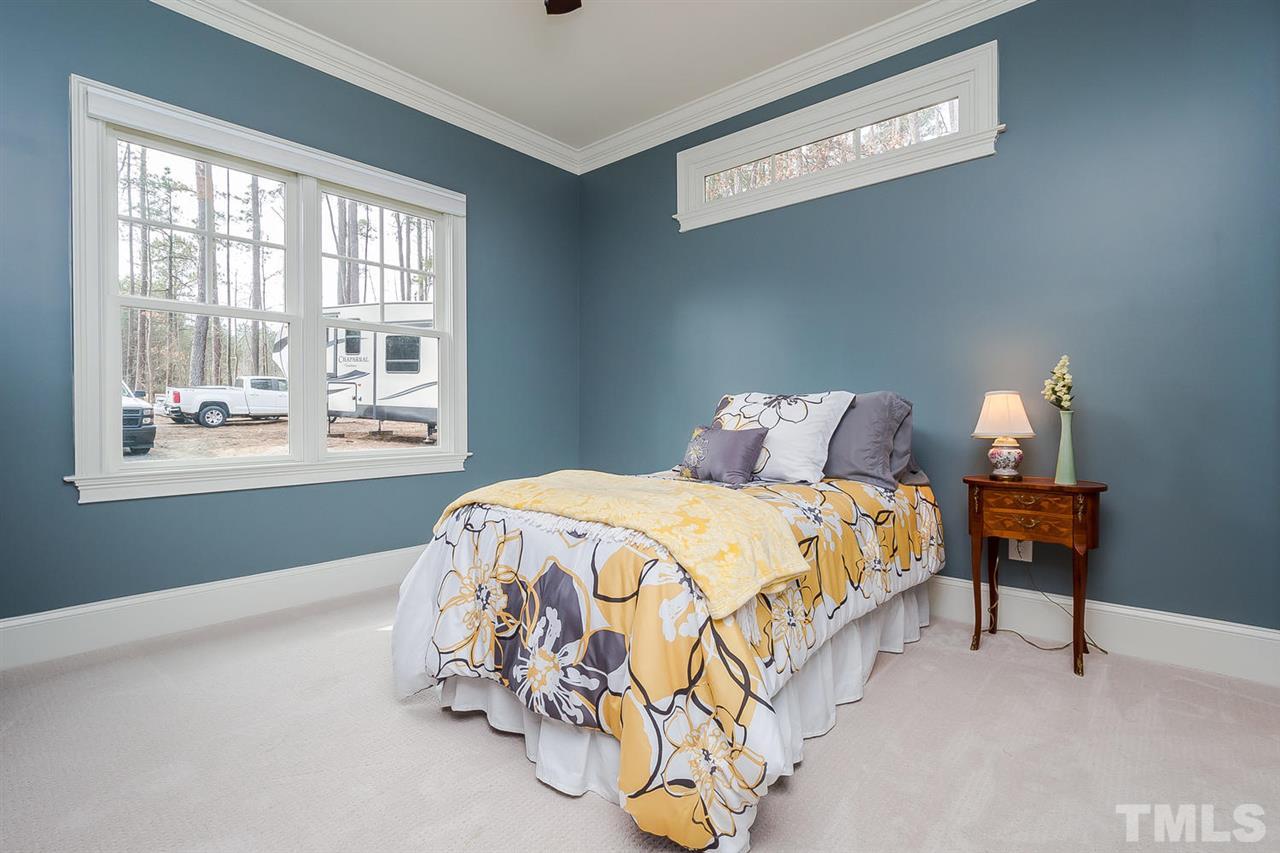 5006 Redwood Road Durham, NC 27704 - Photo 10 of 25 a bedroom with a bed and a window