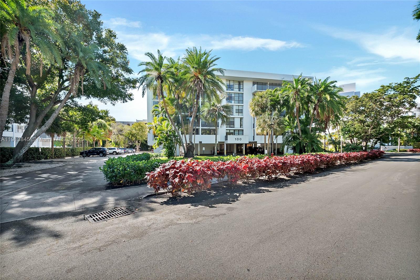100 Ocean Ln Drive, Unit 202 Key Biscayne, FL 33149 - Photo 18 of 22 a view of a street with a building in front of it