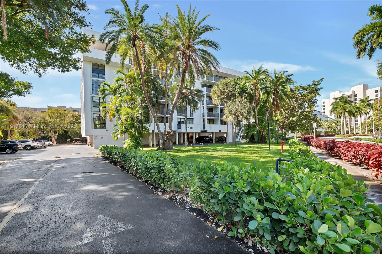 100 Ocean Ln Drive, Unit 202 Key Biscayne, FL 33149 - Photo 19 of 22 a view of a palm trees front of house