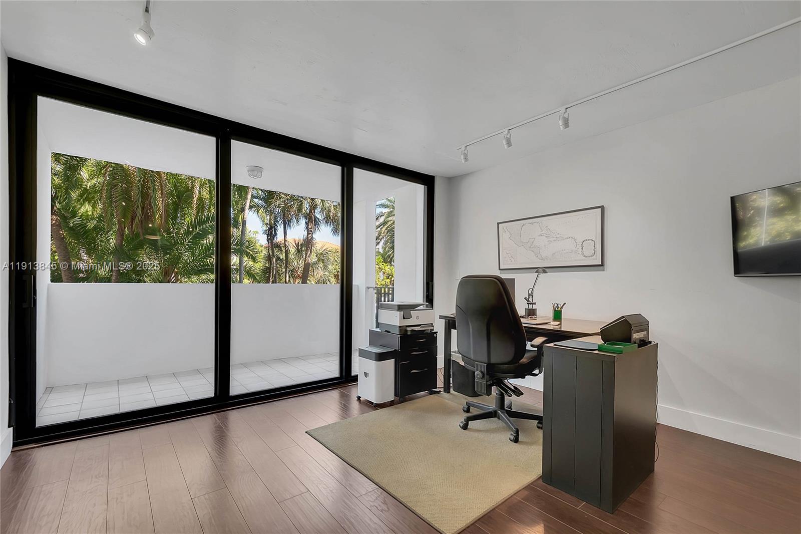 100 Ocean Ln Drive, Unit 202 Key Biscayne, FL 33149 - Photo 4 of 22 a view of a workspace with furniture and a window