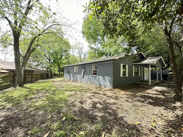 a house that has tree in front of it